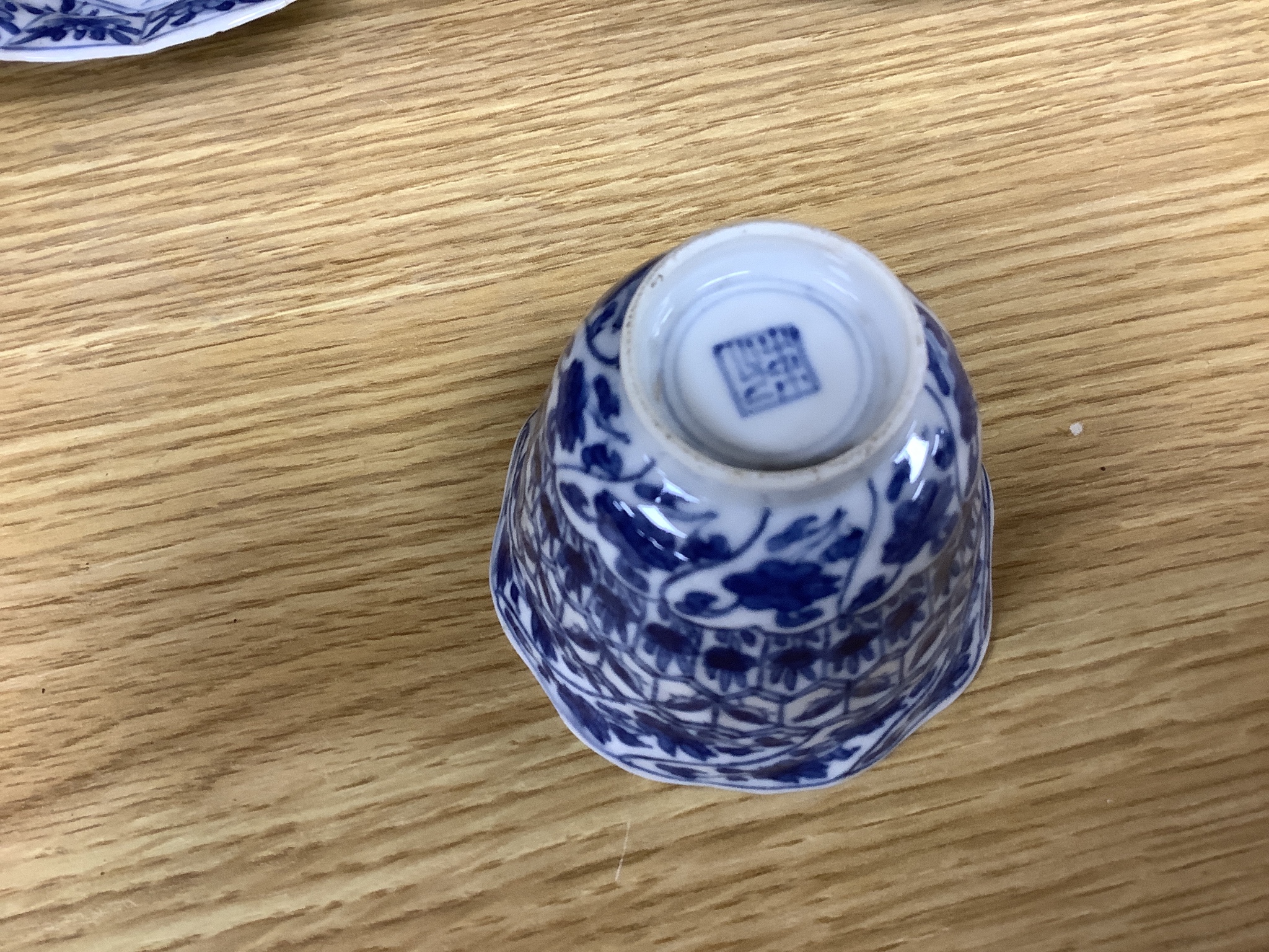 A Chinese blue and white plate 13cm diameter, a similar tea bowl and saucer, Kangxi period and a 19th century Chinese blue and white bottle vase